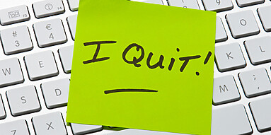 "I Quit" written on post-it note
