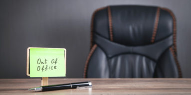 PTO sign on desk.