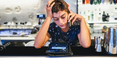 Small business owner reviews options for employee health plans