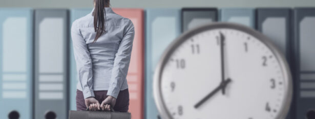 business person looking at clock