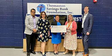 Thomaston Savings Bank Foundation gives check to YWCA.