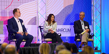 Panelists on stage at The Connecticut Economy conference discuss business best practices.