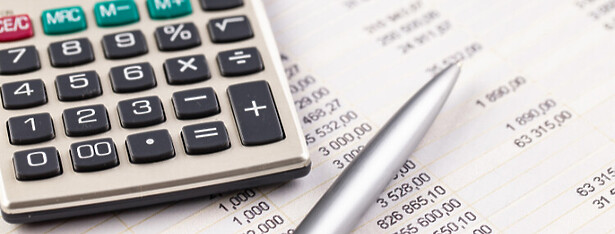 Spreadsheet and calculator on desk